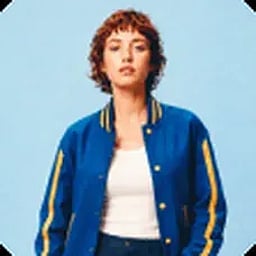 Reference photo of the model in a blue varsity jacket