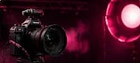 Camera lit by a pink ring light