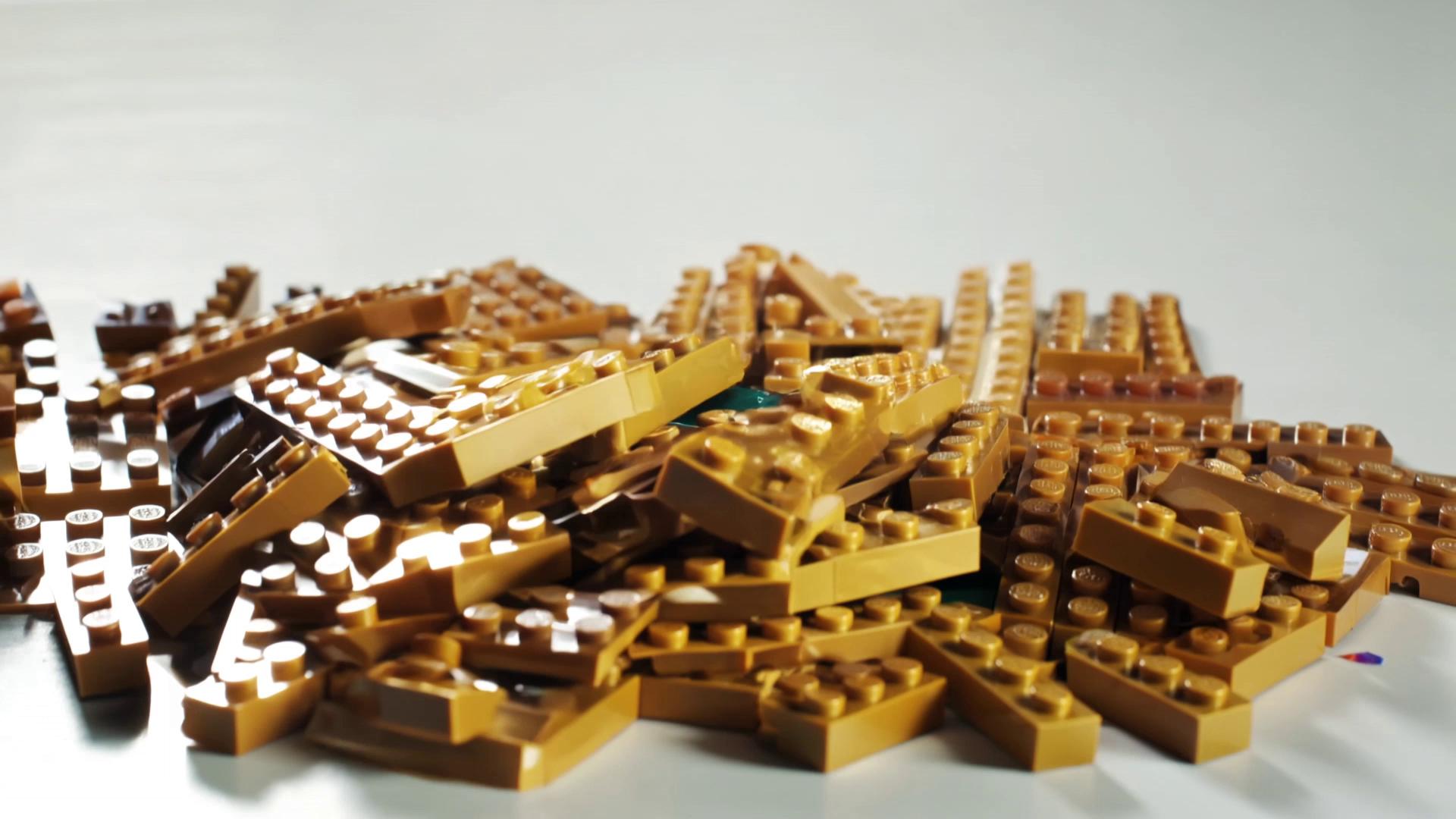 Prompt: A cinematic time-lapse of a LEGO World Cup trophy being built piece by piece on a clean white table. Golden LEGO bricks magically assemble themselves into the iconic soccer World Cup cup. Smooth macro camera shots, dramatic lighting, highly detailed plastic textures, satisfying clicks as pieces connect, slow motion close-ups of bricks locking together. The trophy rises from scattered bricks into a fully completed golden LEGO champion’s cup. Confetti made of tiny LEGO pieces falls around the finished trophy while a small LEGO soccer ball rolls into frame. Energetic sports stadium lighting, epic cinematic atmosphere, ultra-realistic rendering, depth of field, viral YouTube style., cinematic lighting, macro lens, hyper realistic LEGO plastic texture, time laps assembly, dramatic sports atmosphere, depth of field, studio background, 4k ultra detial