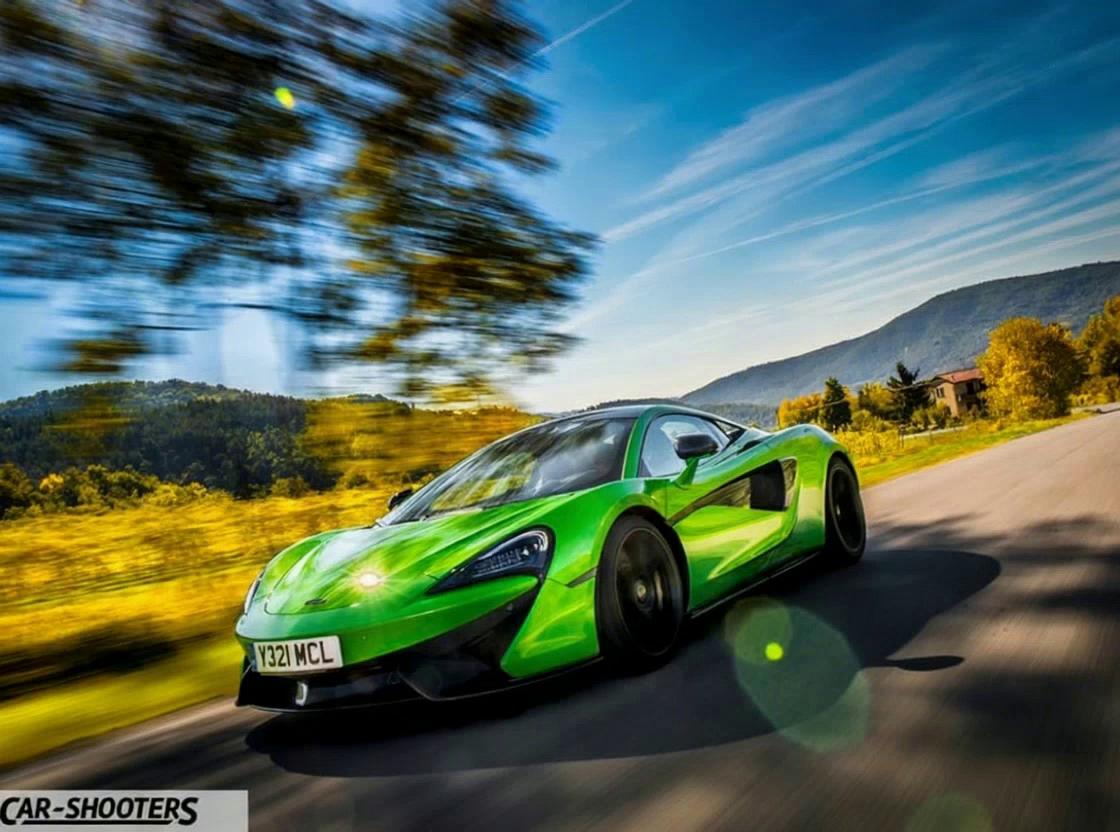 Prompt: a big black dragon with wings flying and chasing the green car on the motorway, volcanic eruptions explode on the sides of the road and then an angel with giant wings that spread across the horizon descends from the sky and slays the dragon with a golden sword.