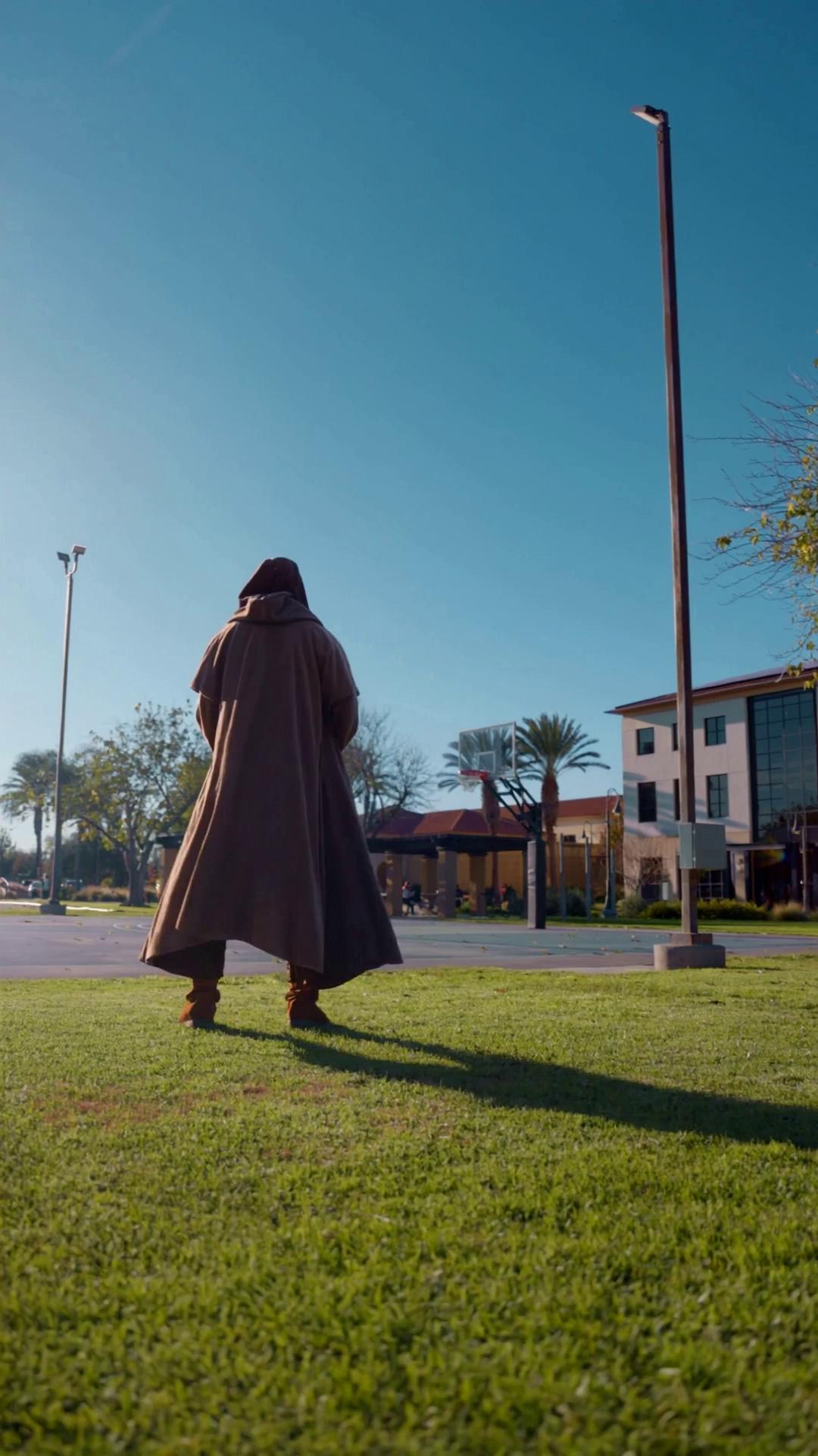 Prompt: Have a Jedi filmed from behind shooting hoops that are impossible to make. 
