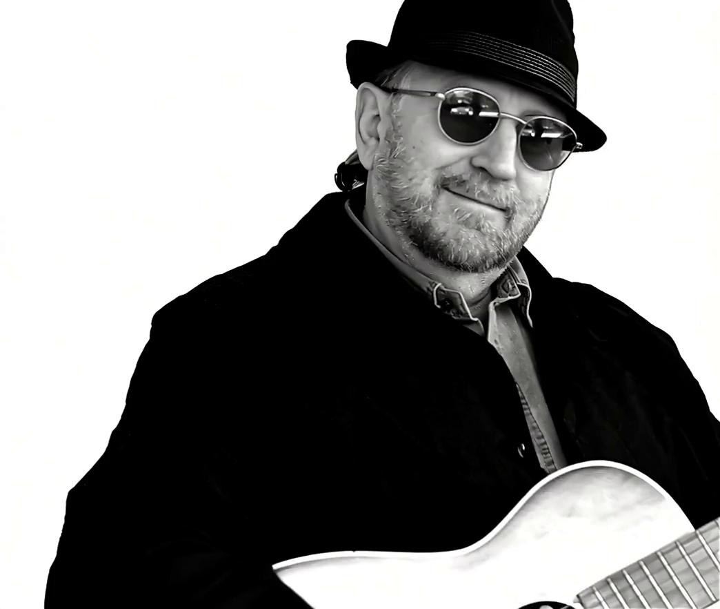 Prompt: Glen Hornblast driving a red 1957 Chevy Bel Air viewed from the front from far away driving through the desert