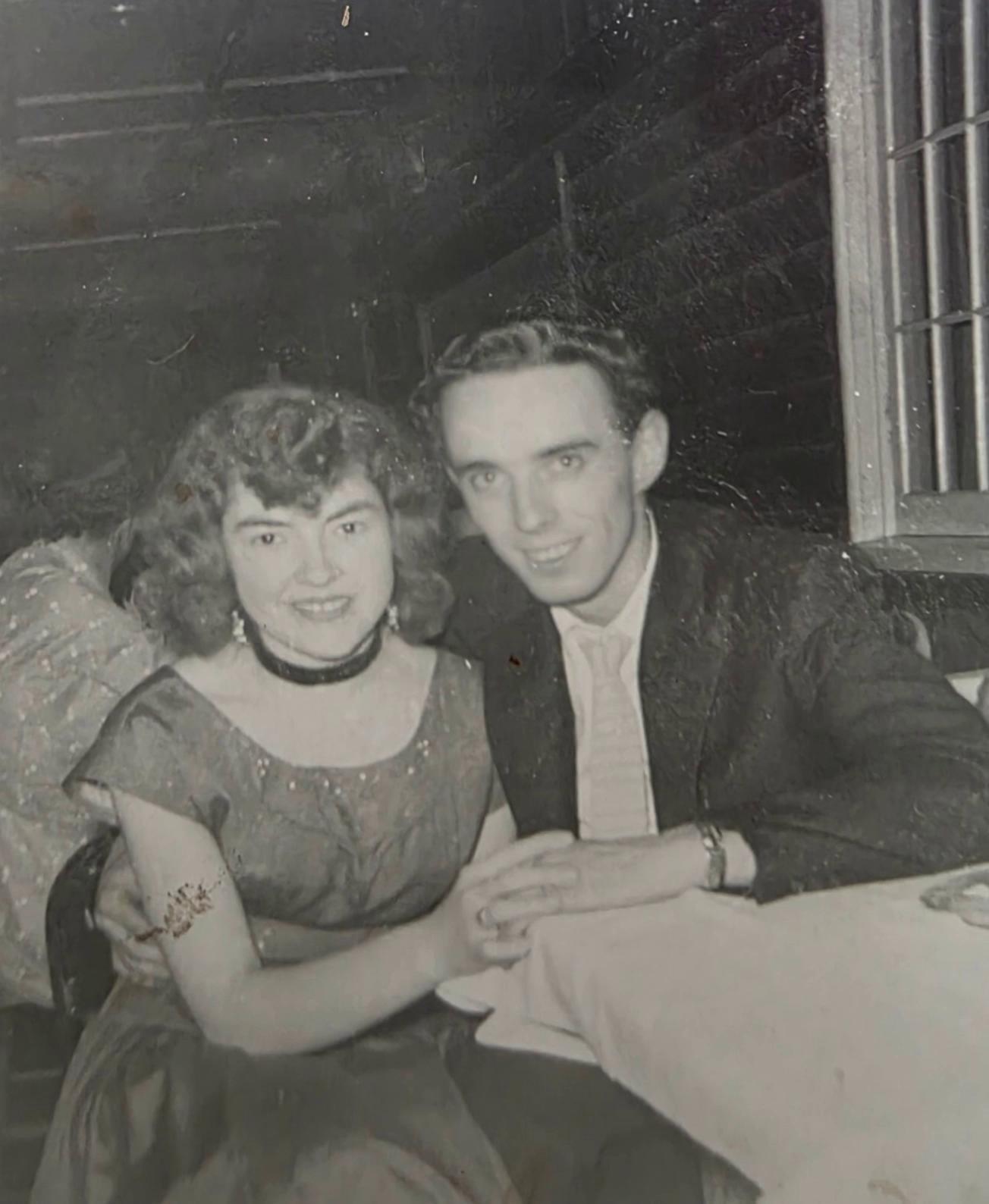 Prompt: Make this into a scene where the male is proposing to the woman to marry him with a ring. Make him get down on one knee to propose her hand in marriage