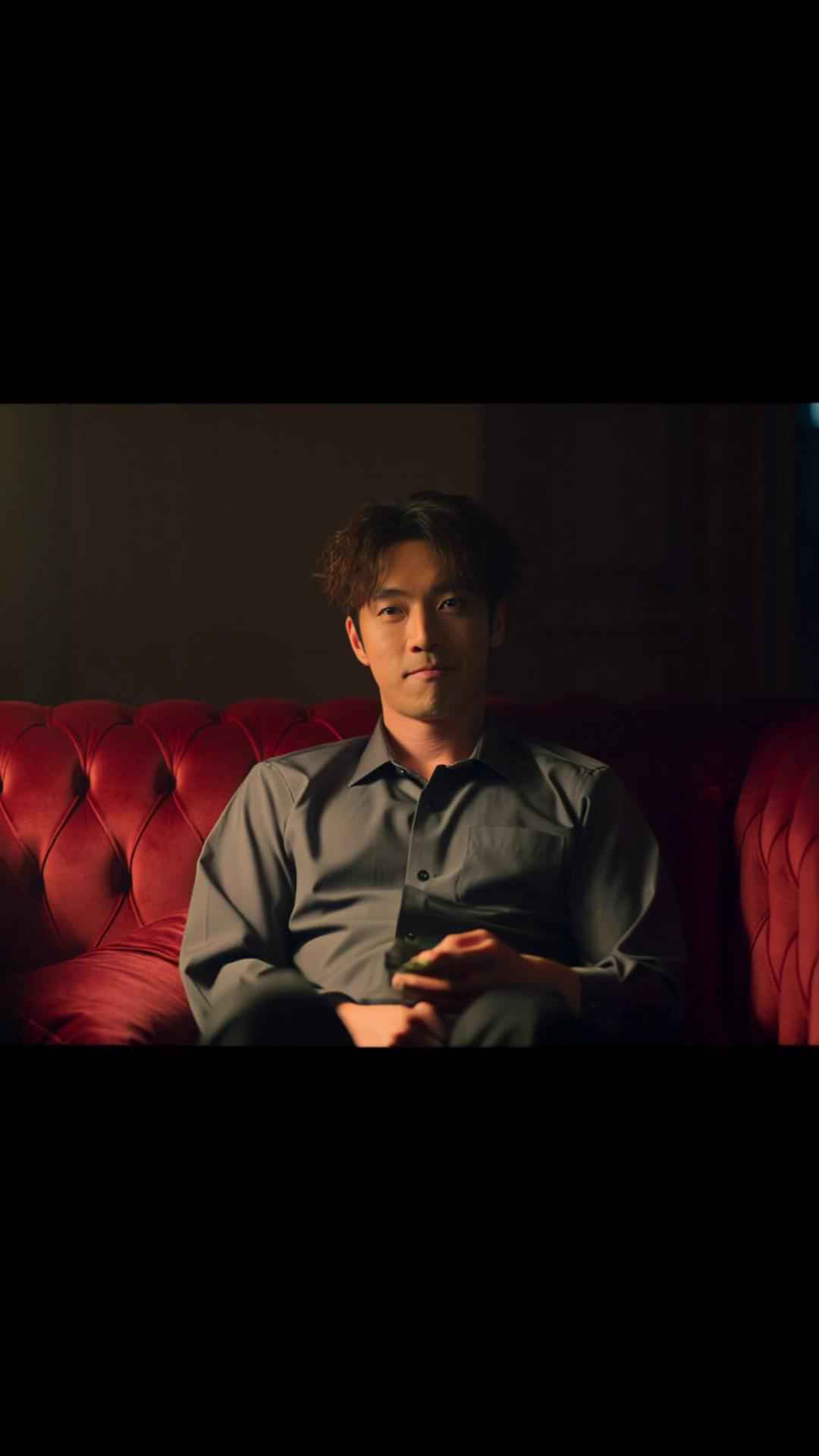 Prompt: Vertical 9:16 cinematic short film, realistic style.
A 28-year-old Asian man sitting sloppily on a red velvet single sofa in a dim room. 
He crosses his legs arrogantly, shirt slightly wrinkled, messy hair, subtle smirk. 
Low key lighting, dramatic shadows, shallow depth of field, slow camera push in. 
Cut to quick flashbacks: man checking phone during date, interrupting a woman, arriving late casually. 
Serious tone, realistic acting, cinematic color grading, moody atmosphere.
Ending with freeze frame and fade to black.
Film look, natural skin texture, high realism, emotional tension.