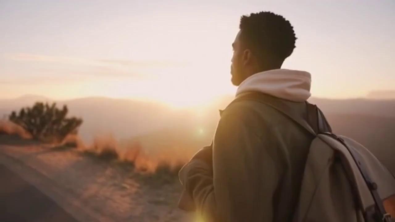 Prompt: Time Visual Suggestion Audio / Voiceover
0-3s Slow motion shot of a sunrise or someone walking. "Life isn't about finding yourself..."
4-8s Cut to a close-up of hands working or eyes smiling. "...it’s about creating yourself."
9-12s Wide shot of a landscape or city skyline. "Stop waiting for the light. Be the spark." ( Make audio in English) Character African American 