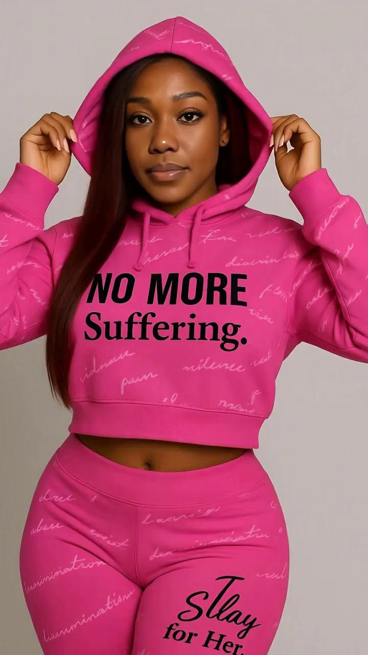 Prompt: Scene Start:
A brown-skinned woman in a bright pink hoodie and jogger set stands front and center. Her hoodie reads “NO MORE Suffering.” The vibe is bold, elegant, and unshaken.

Camera Movement:
Start with a slow zoom-in on her face. She adjusts her hood with both hands, locking eyes with the camera. A subtle breeze lifts a strand of hair.
Lighting Direction:
Use soft glam lighting that gently highlights her cheekbones, the pink tones of her outfit, and the empowering message on the clothing. Add a very soft studio light glow on the edges for a luxe finish.
Mid-Scene Motion:
She shifts her weight slightly and turns to the side. The camera follows the motion — smooth and graceful.

Music Cue:
Use a cinematic, female empowerment instrumental — think a slowed-down violin with trap-style drums building softly in the background. (Similar to the "Be Alive" by Beyoncé intro.)
Final Scene:
She faces front again, crosses her arms, and stares into the lens.
The background subtly darkens behind her,