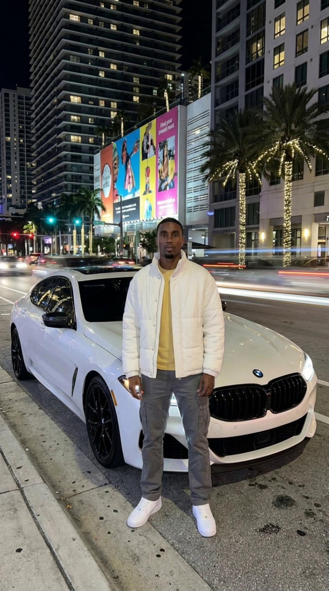 Prompt: Create a vertical cinematic finance b-roll video from the input image.

Scene shows a calm nighttime city street with soft traffic light streaks and urban buildings in the background. The subject stands still in the foreground, centered, composed, and grounded. The vehicle remains part of the environment, not the focus.

Camera performs a slow, controlled push-in toward the subject, emphasizing clarity and intention rather than luxury or status. Motion is subtle and smooth.

Lighting remains natural to the nighttime scene with balanced exposure — no dramatic highlights or stylized glow. City lights create gentle ambient motion in the background while the subject remains steady.

Mood is calm, serious, and reflective — suitable for financial education and long-term thinking. The scene should feel grounded and real, not flashy or aspirational.

Final frame should closely match the opening frame to allow seamless looping.
