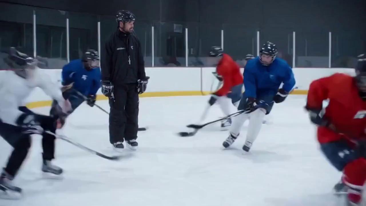 Prompt: A cinematic ice rink scene during hockey practice. A coach wearing a black jacket and helmet stands on the ice holding a whistle. Around him, a group of youth hockey players in full gear skate quickly across the ice, performing fast drills. The atmosphere is energetic, with ice shavings spraying as they stop sharply when the coach blows the whistle. One player skates up to the coach, lifts their helmet slightly, and politely asks, “Can we please keep skating?” The coach smiles, nods, and blows the whistle again. The players immediately burst into motion, skating hard with enthusiasm. The camera smoothly follows the action from ice level, capturing crisp details of the players’ movements, reflections on the ice, and a slight cold mist in the air. Lighting is bright and realistic, with natural rink ambience and sounds of skates cutting the ice and the whistle echoing.