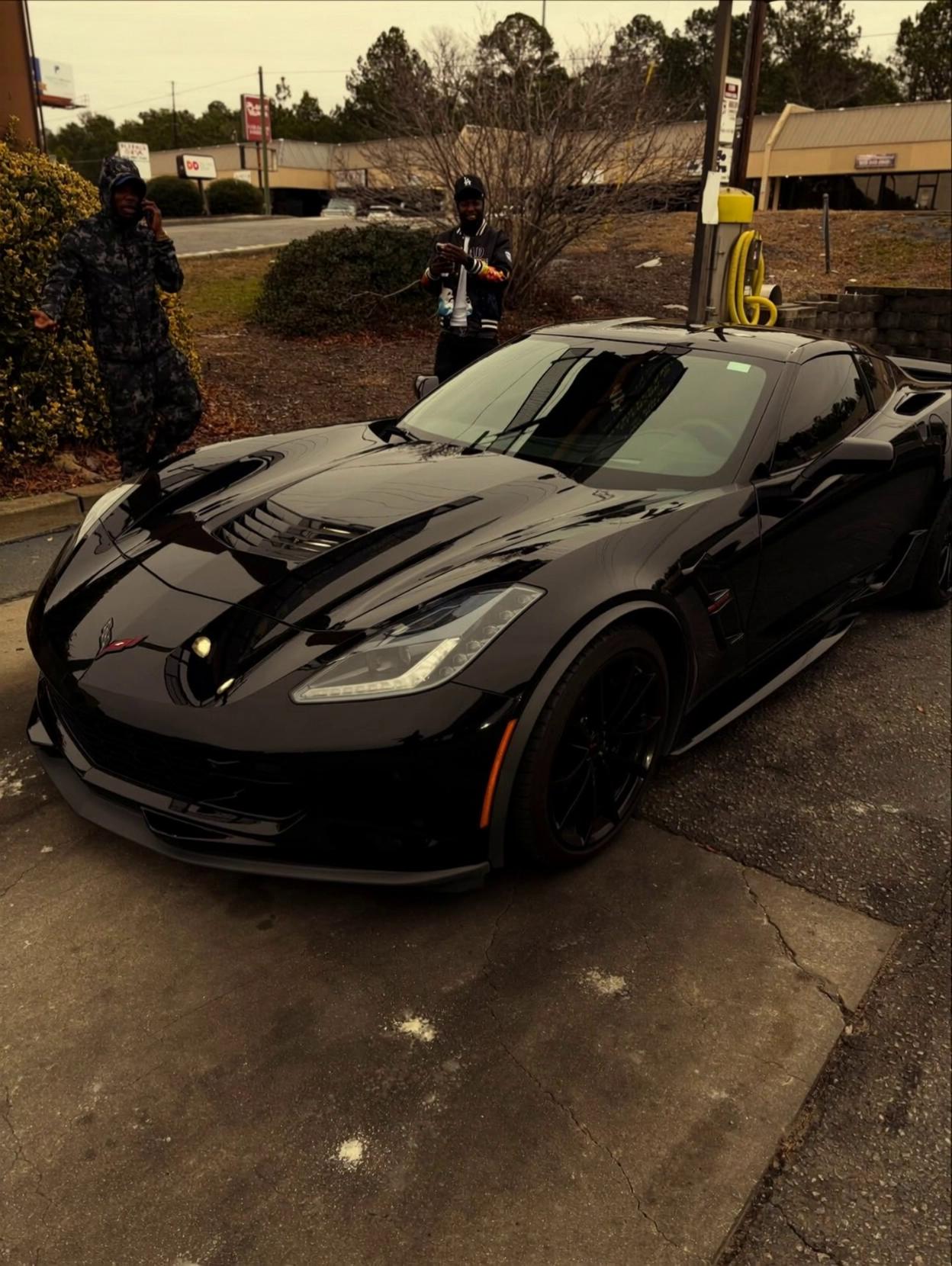 Prompt: keep the 2 men composition, face, and skin color consistent.  make the black car in the start frame, transform into the robot in the end frame.