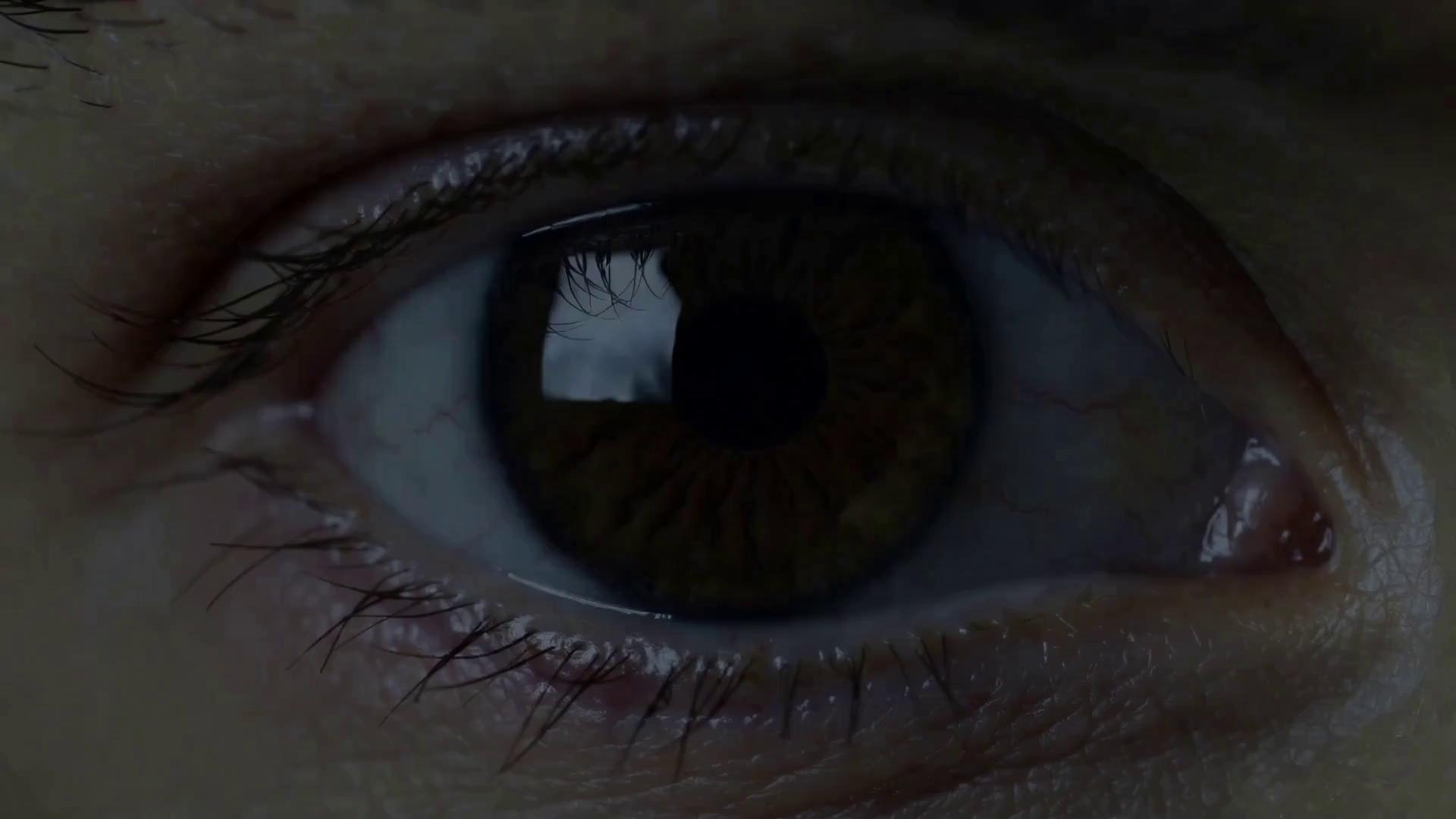 Prompt: Extreme close-up on a human eye. It glitches violently, the iris shattering like glass to reveal a nebula within.