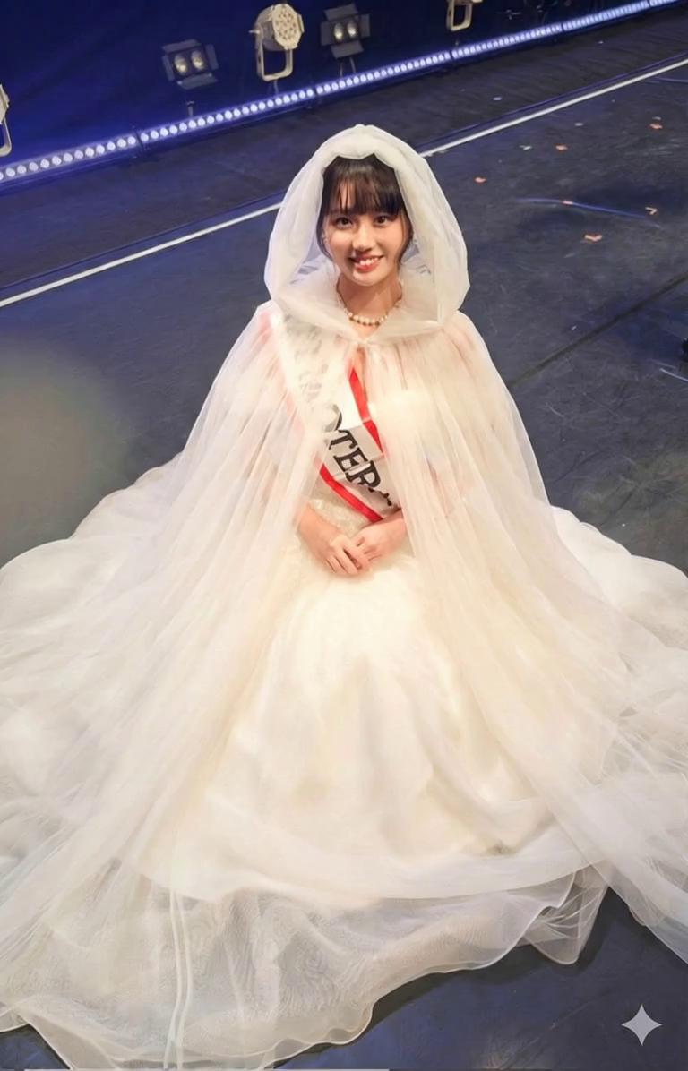 Prompt: asian witch brides' head and body shrinks and melts into their chiffon gowns, and gowns fall to the floor into a messy piles, deflating to flattened as she melts away. their gowns  falls and deflates as they melt underneath it. they scream "I'm melting" repeatedly during this process, and smoke is emerging from their gowns 