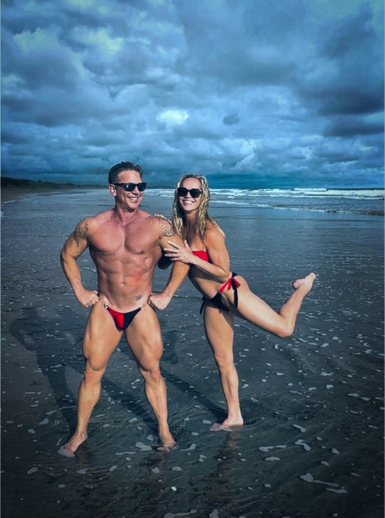 Prompt: My wife and I having fun in the beach