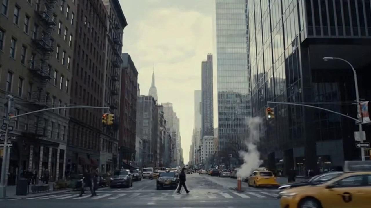 Prompt: The humans in planet are enjoying a normal day in new york city. The scene cuts to a person with a suit working in an office with his laptop as he is calling his manager on the phone when he looks out through the left window of the office building he sees a strange mysterious alien ship flying past the horizon which was barely noticable. 