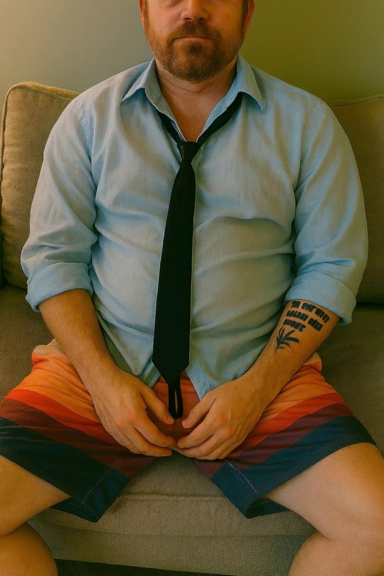 Prompt: Gradually turn this man's clothes into a business suit, have him freak out as this happens 