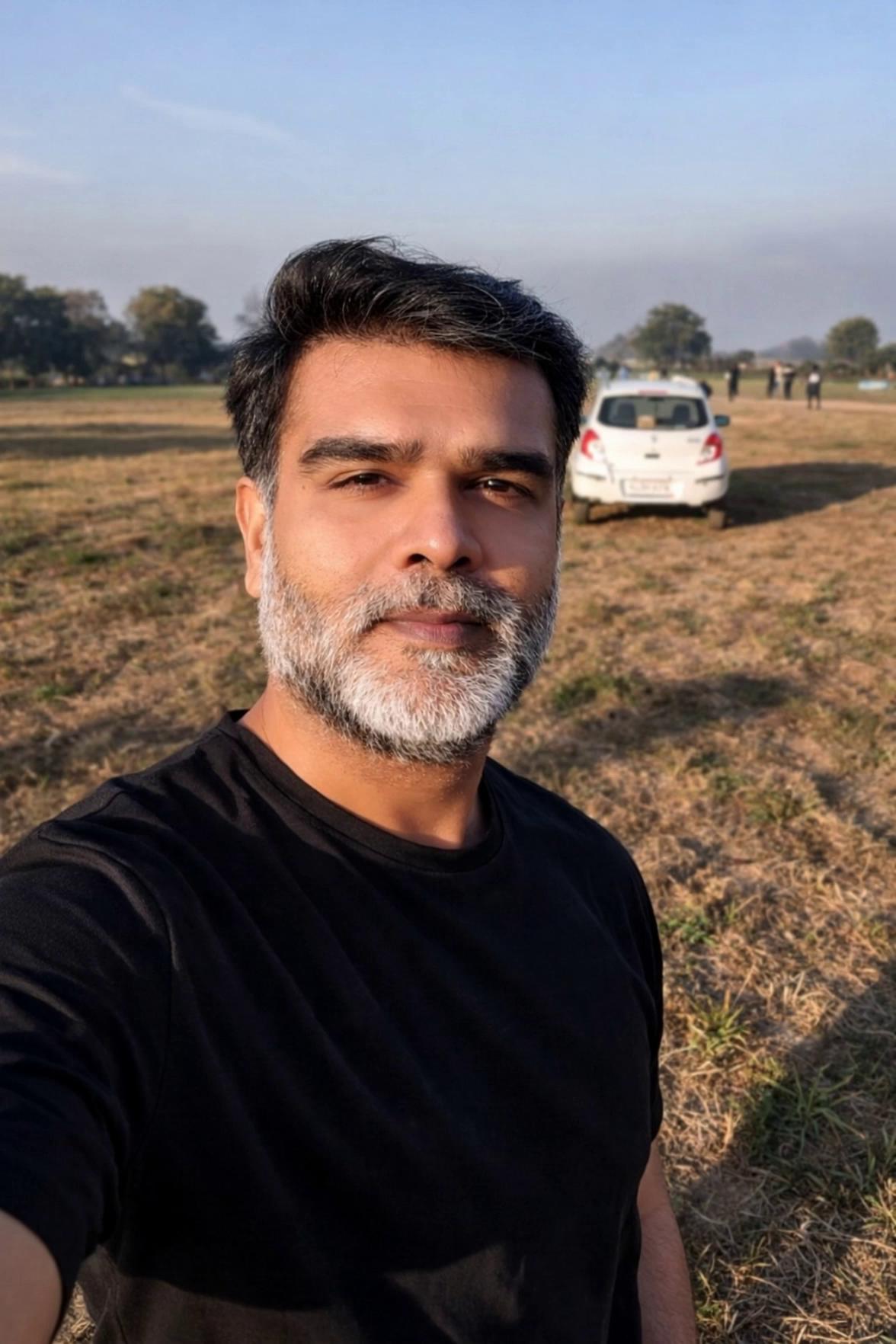 Prompt: Make background and attire of the man formal and he is narrating - 'If you are earning less than or equal to 12 Lakhs rupee, you don't need to pay and taxes under the new tax regime, subscribe to get further details on this'