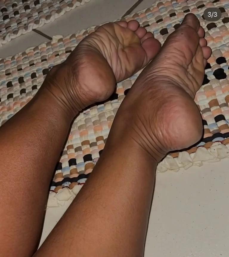 Prompt: The toes from the foot of a chimpanzee gently tickles the toes and sole of the human foot