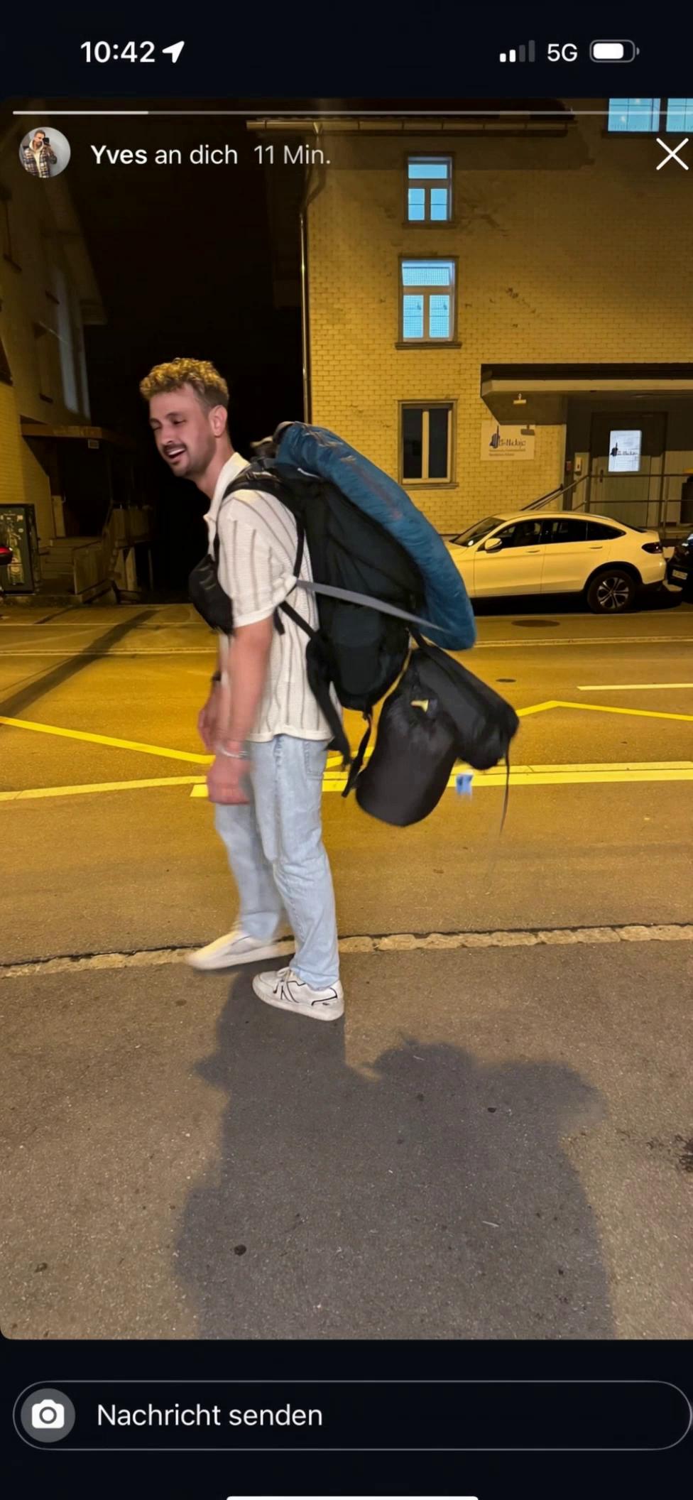 Prompt: A young man with a large backpack stops under a streetlight at night. He suddenly drops his backpack to the ground and starts crying dramatically. Zoom in on his sad face, with emotional piano music and rain starting to fall. The mood is tragic but slightly ironic.
