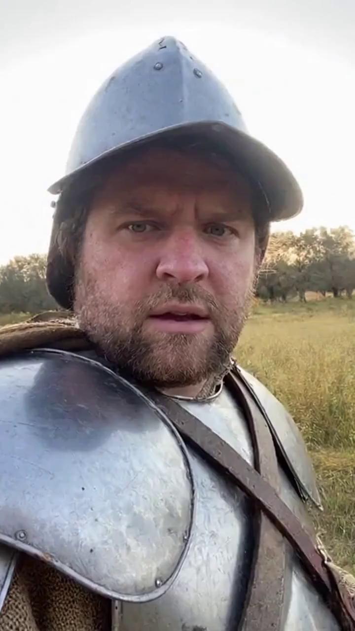Prompt: A medieval knight wearing worn armor and simple medieval clothing is holding a camera in selfie mode. The camera is slightly shaky, as if he just turned it on.
He looks confused and blinks slowly.

He says calmly:
“Okay… um… hello?
Can anyone hear me?”

He looks around nervously.

“I don’t really know where I am…
but I’m pretty sure… this is not the year 1324.”

Natural daylight. Soft cinematic lighting.
Realistic facial expressions.