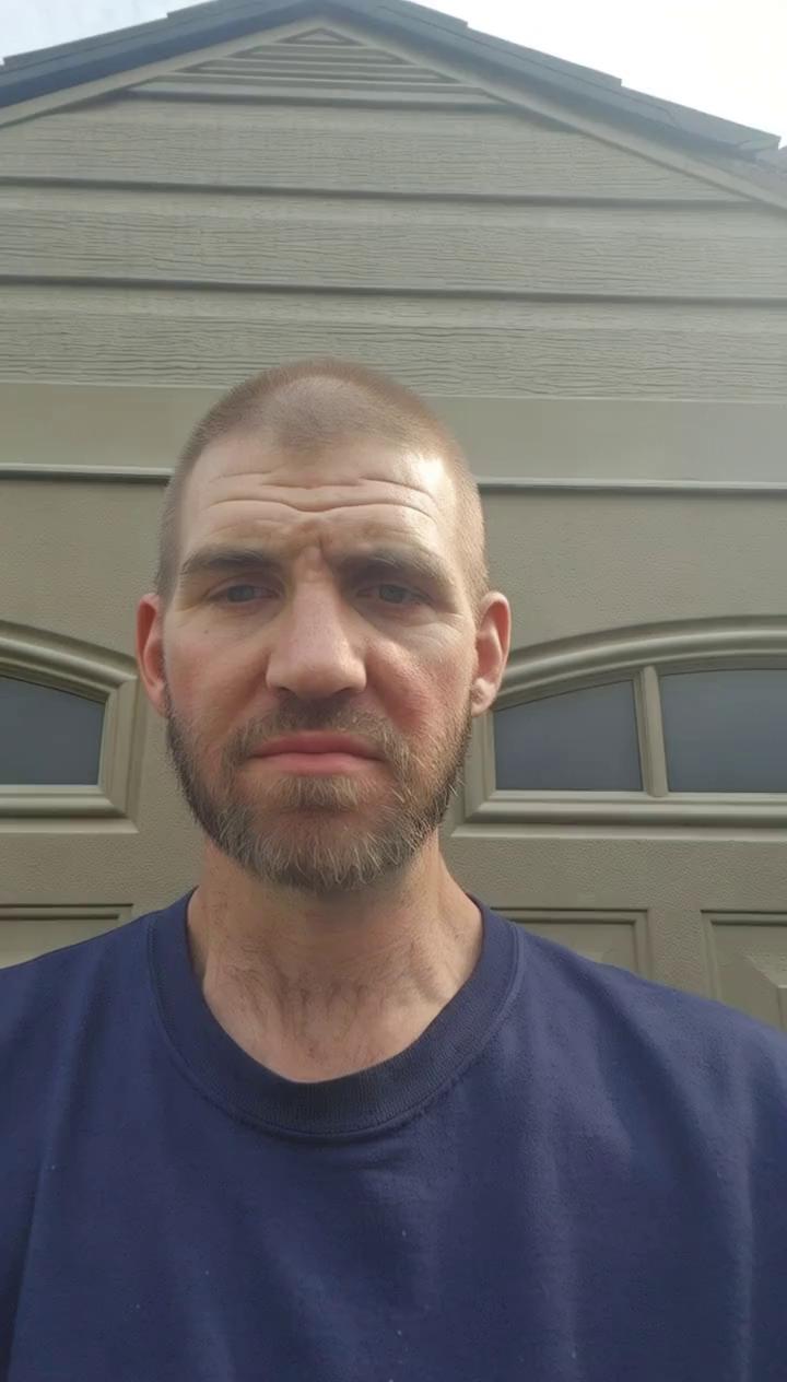 Prompt: Make a video of him saying Brenda I love you and make him show around is environment 