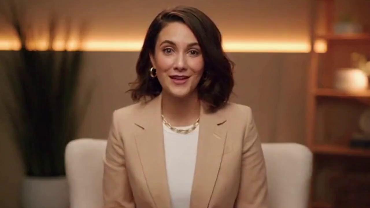 Prompt: To create Option C — a Sora prompt WITH YOU in the scene,
I need one clear photo of you (full body or half body is fine).

Sora cannot generate an accurate likeness without a reference image,
and I cannot ethically guess what you look like.

Upload a photo where:
	•	Your face is clearly visible
	•	Lighting is decent
	•	You’re front-facing or slightly angled

Once you upload it, I’ll build the SORA-optimized, ultra-realistic prompt that places YOU in your new studio:
	•	Sitting in the white chair
	•	Cinematic lighting
	•	LED /// background
	•	Beige room aesthetic
	•	Wellness creator vibe
	•	High-authority coaching look

Send the picture when you’re ready.