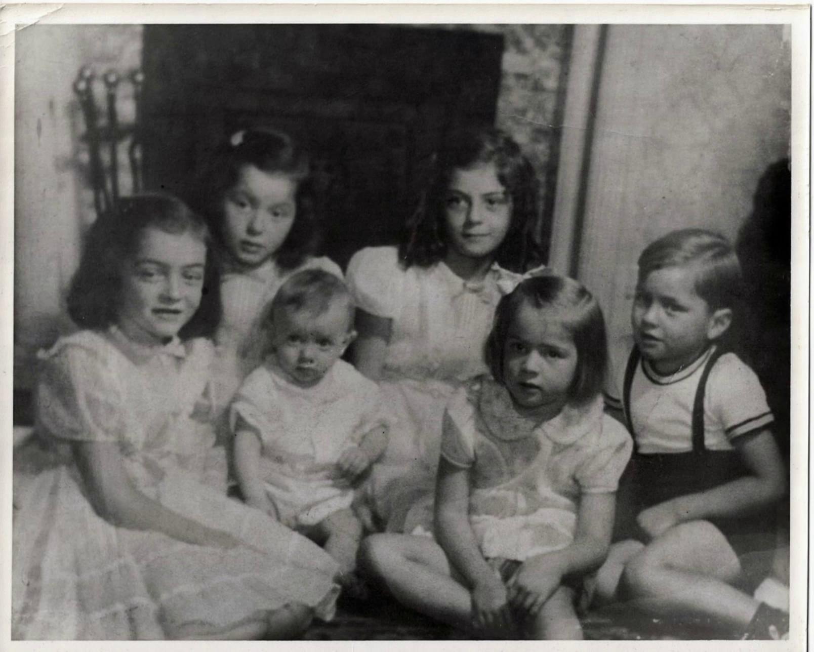 Prompt: Girl on left @[young girl voice]  says "Say cheese!" @voice-1778448792222All the children to her left should be laughing.