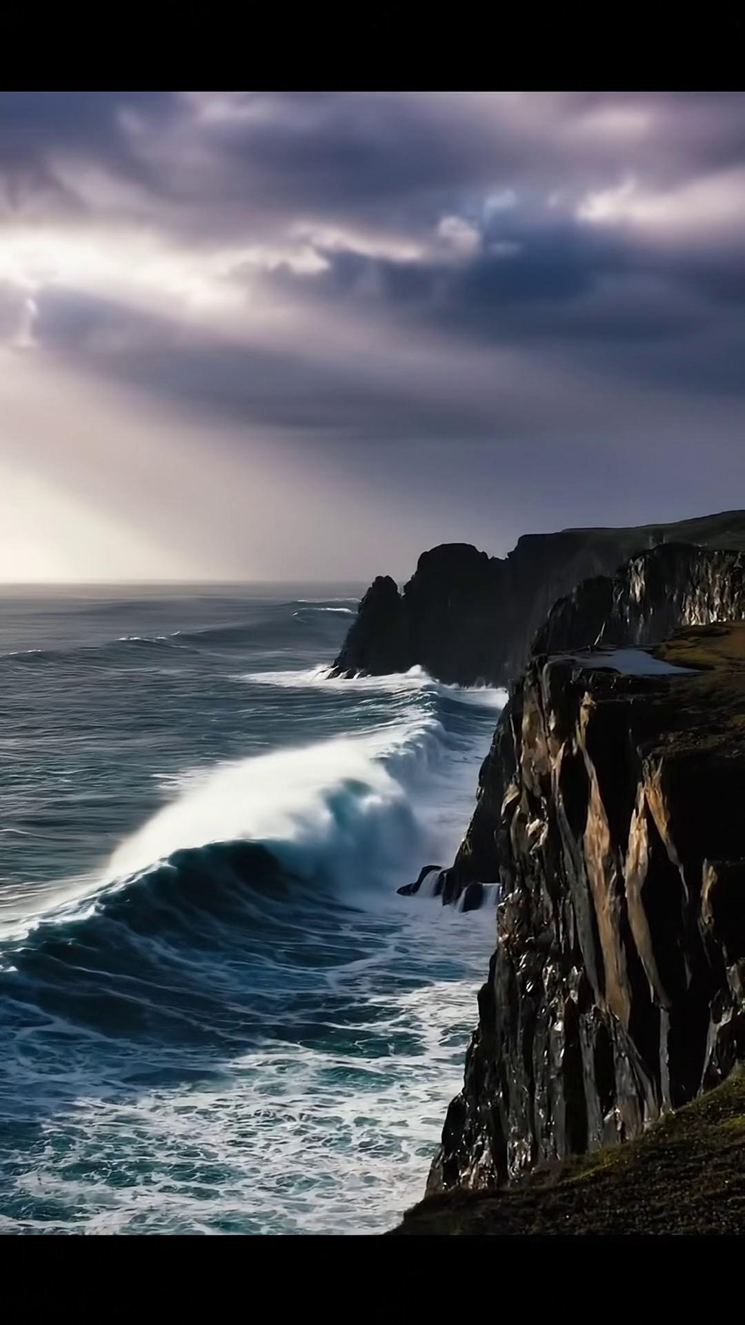 Prompt: Picture a vast ocean under a dramatic dark sky. Powerful waves crash against rugged cliffs, sending sprays of water high into the air. The scene is majestic and awe-inspiring a raw, passionate display of nature’s force, evoking inspiration and grandeur as each wave meets the stone.