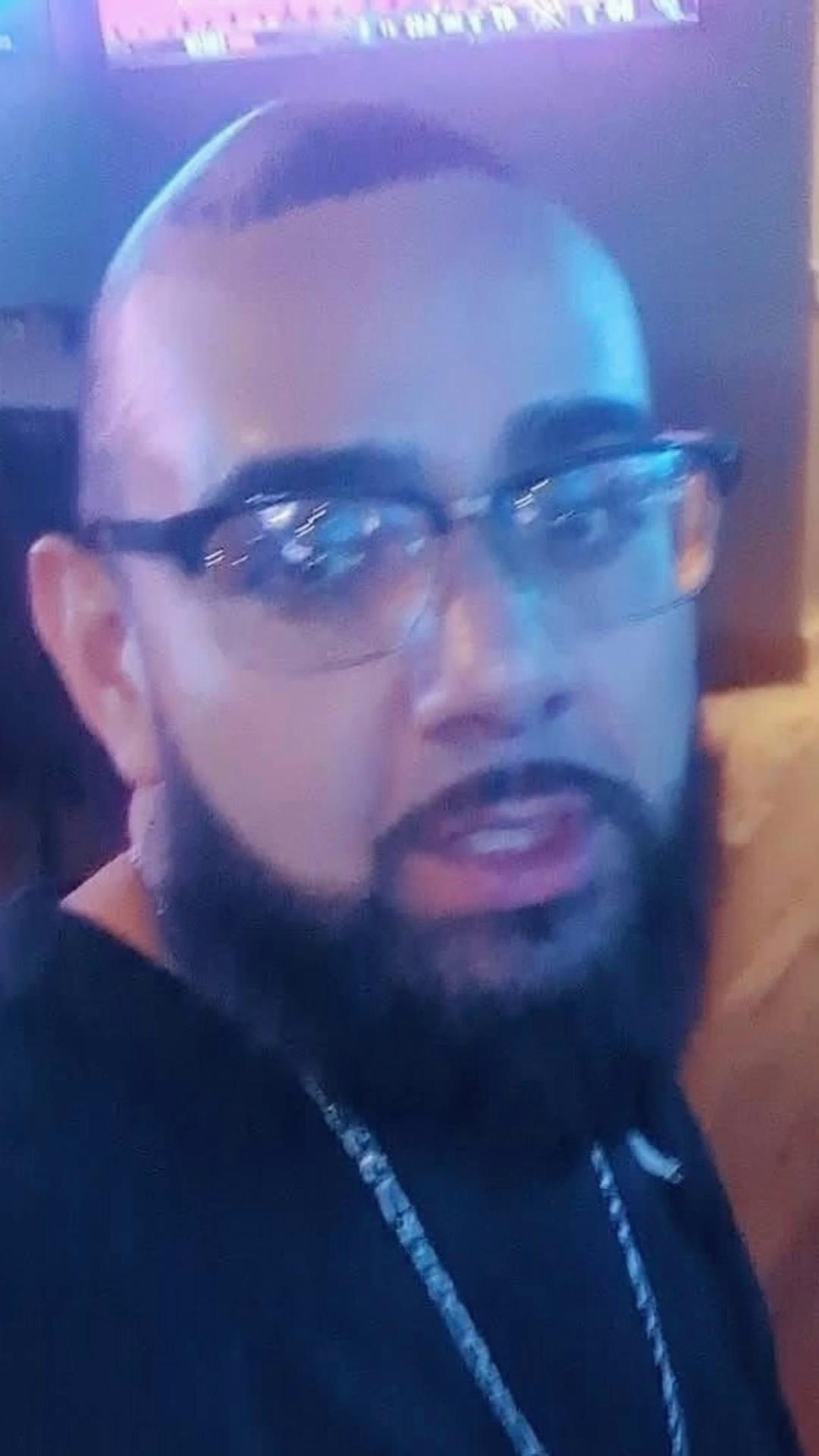 Prompt: He will then run to him and give him a hug behind him is a plaque on wall that clearly says EPSTIEN