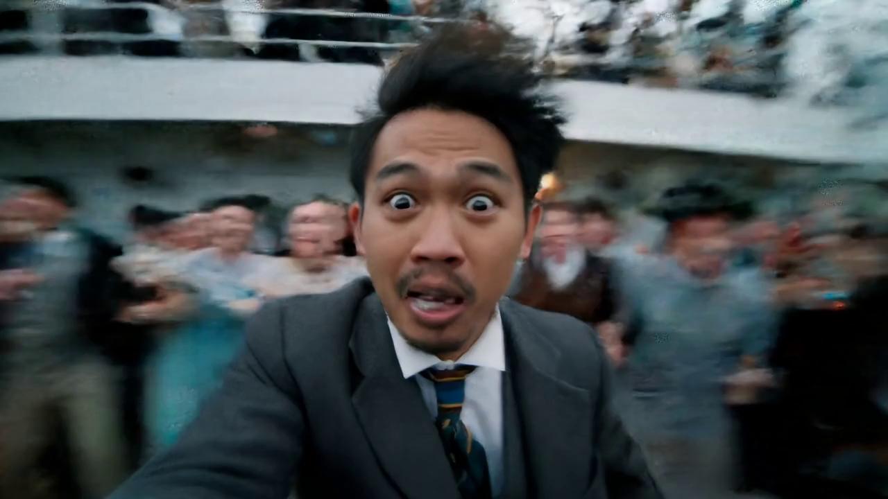 Prompt: Filipino guy (around 20s), same outfit (early 1900s Titanic clothing), same hairstyle, and now with a bit of facial hair (light mustache + goatee)—still chaotic, still vlog-style, and still tanginang funny. 😂

SCENE: Titanic deck, full-blown chaos. Passengers scream. The iceberg is terrifyingly close. Camera shakes as the Filipino guy vlogs with panic-laced sarcasm.

GUY (sour smile, voice breaking):
"Wala man lang kiss bago lamig! Tangina naman oh!"

SFX: Ice scraping the hull — metal creaks, people scream “Lundag naaaa!!”

He clutches the rail, camera still rolling.

CUT TO BLACK.