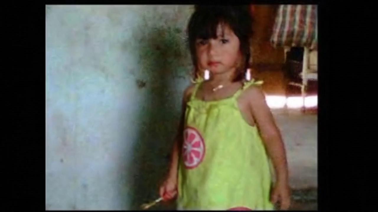 Prompt: Brisi is playing with her little friends at the park. She is caressing a little squirrel while she is strolling through the bushes and the trees. Then, she gets into the gentle waters of a stream.