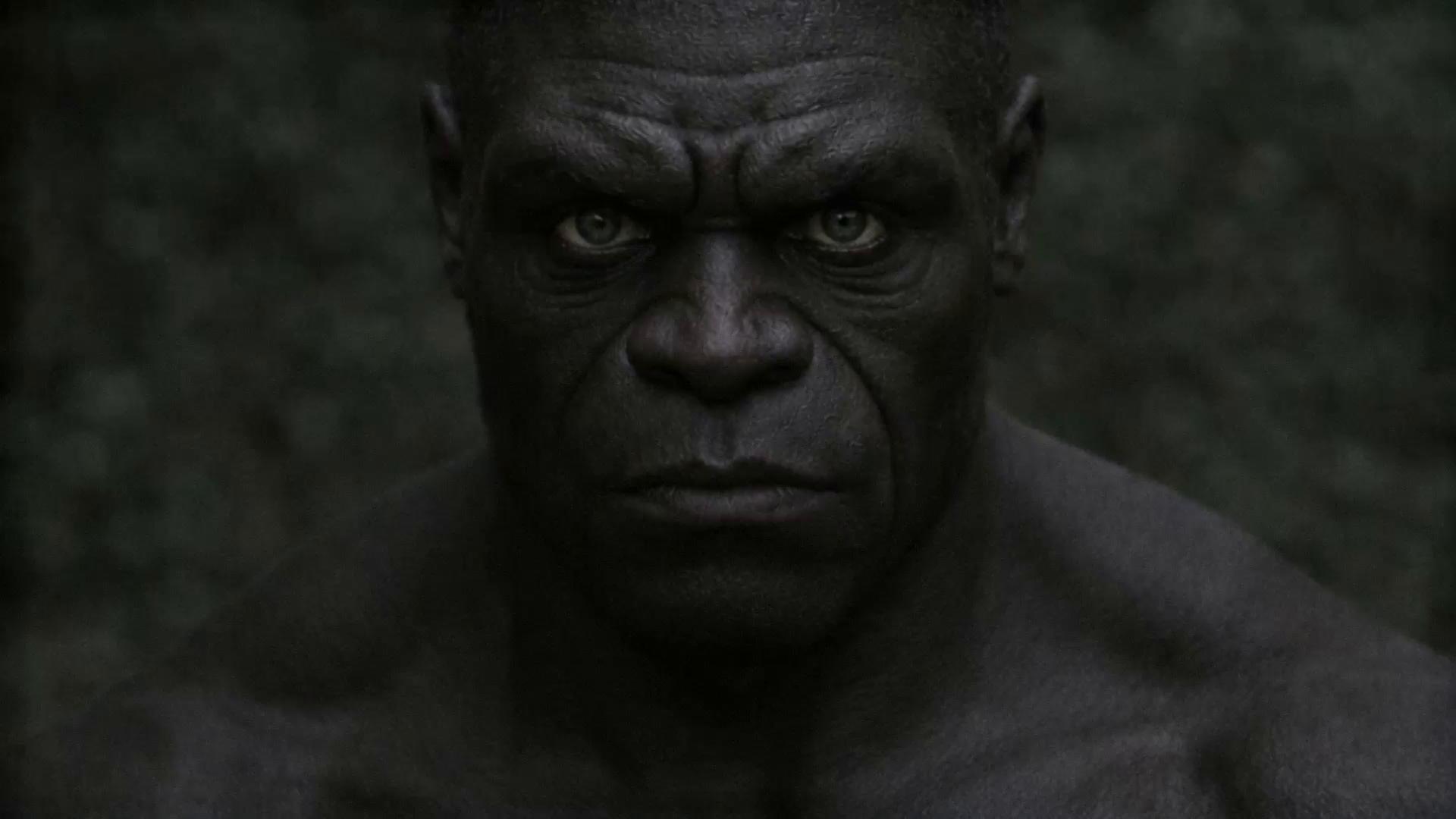 Prompt: Hyper-realistic cinematic character motion test.
A massive adult male with dense black skin and restrained gray eyes stands motionless in a dark environment.
Camera locked, medium-close framing (chest to head).

The character remains completely still for several seconds, then takes one slow controlled breath.
Subtle chest rise, micro tension in neck and jaw.

He slowly turns his head approximately 35 degrees to the side.
His eyes move first, locking onto an unseen presence before the head follows.
No facial expression change.
No glow, no stylization, no exaggeration.

He returns to center and becomes still again.

Real human skin behavior, realistic muscle deformation, natural eye movement.
No camera movement, no dramatic lighting changes, no visual effects.

