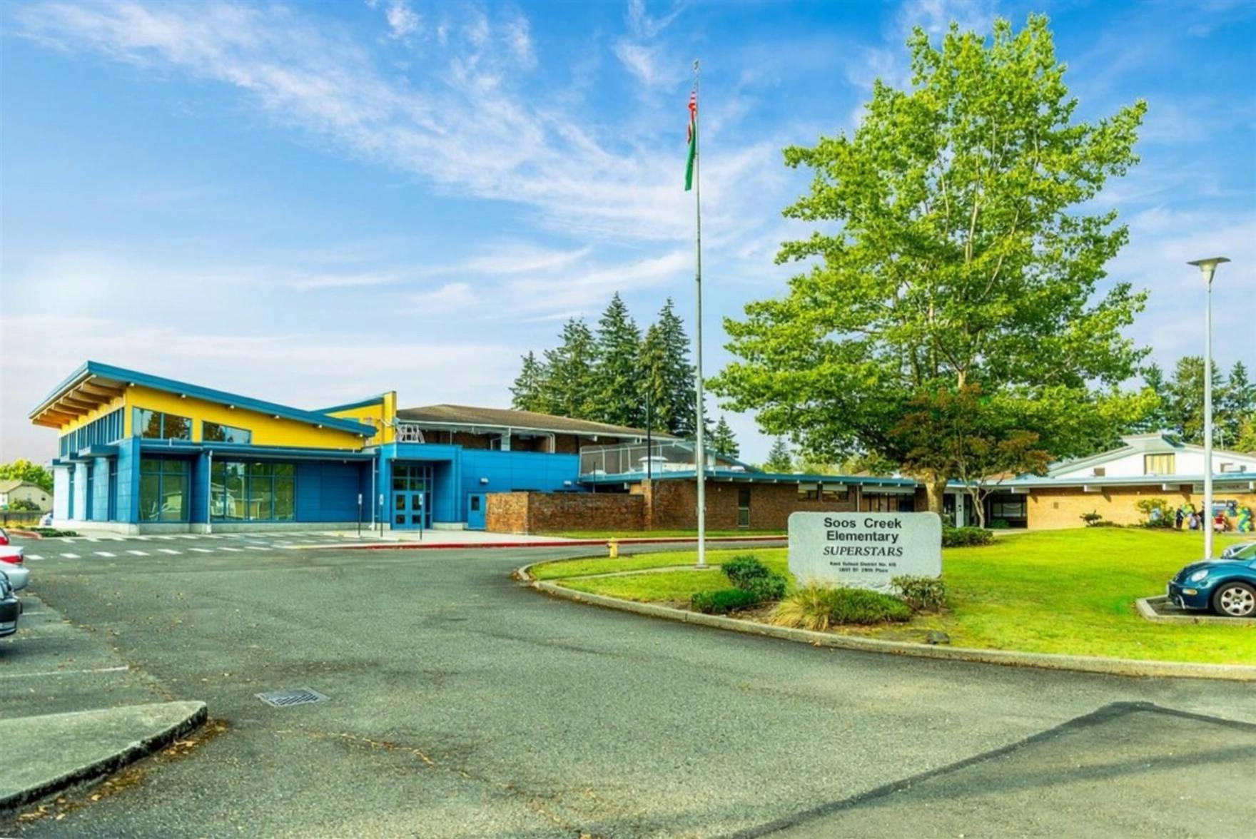 Prompt: Begin with a still, wide, outdoor shot of a sunny elementary school exterior. Abruptly, the scene erupts into vibrant, fantastical chaos: iridescent smoke swirls playfully from all sides, colorful papers and lightweight debris cyclone through the air with joyful abandon. From off-screen giant tentacles reach out and then withdraw back out of the shot. An alicorn then walks into the background, spreading its luminous, ethereal wings, then exits. Then a spaceship descends from above, hovers, then speeds away. A cute robot zips along, emitting playful, colorful laser beams.  Photorealistic cinematic style with dynamic, vibrant lighting.