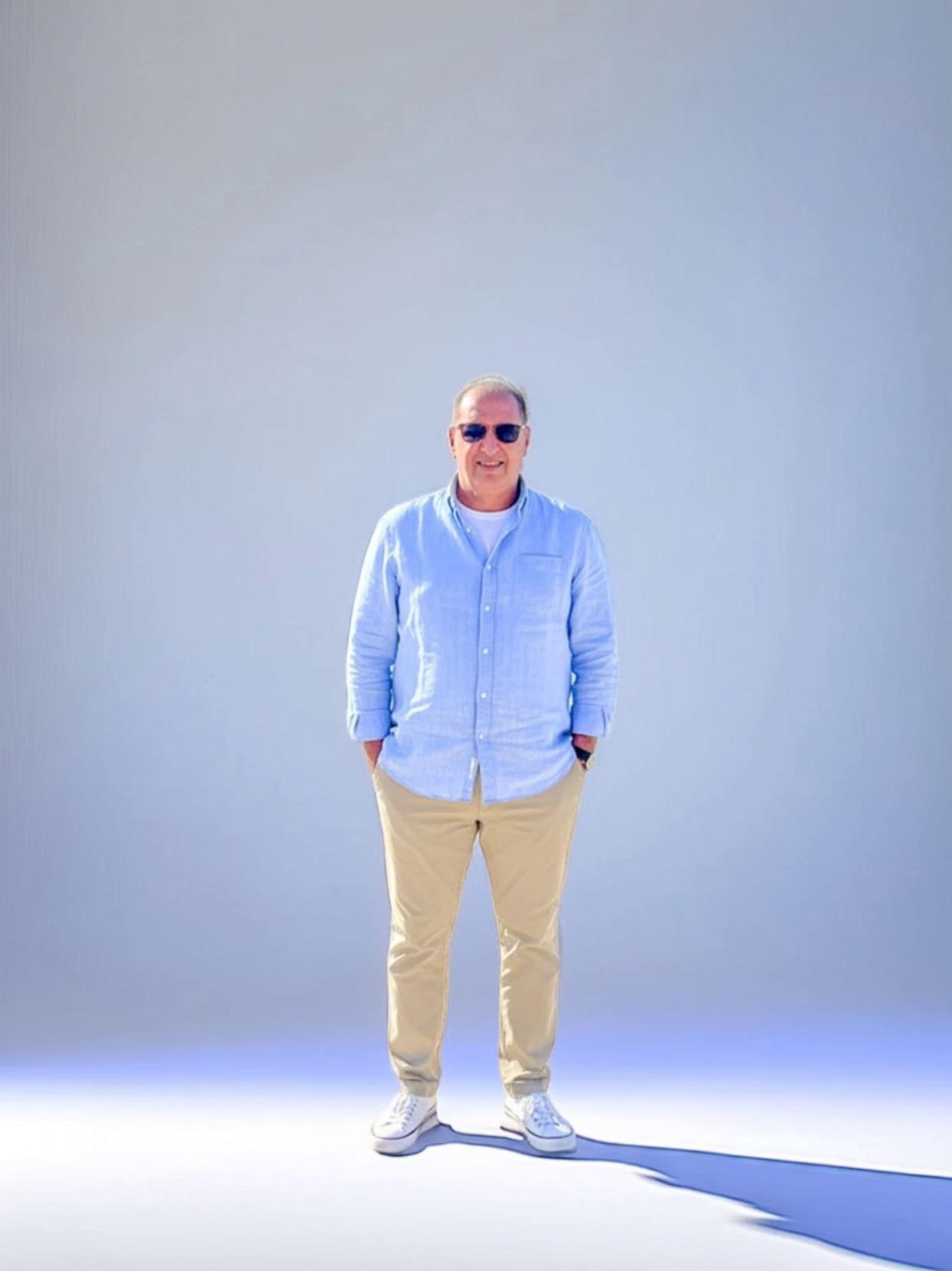 Prompt: Afifi Al Shimy walks confidently inside Dubai Mall, elegant and welcoming, with luxury shops and glass interiors around him. Transition to nighttime outside at the Dubai Fountain: Afifi stands with Burj Khalifa illuminated behind him as the fountains dance with light and water. He smiles proudly, hands open as if welcoming visitors to Dubai. Night cinematography, dramatic lighting, reflections on water, high realism, premium travel film style, 4K ultra-detail.