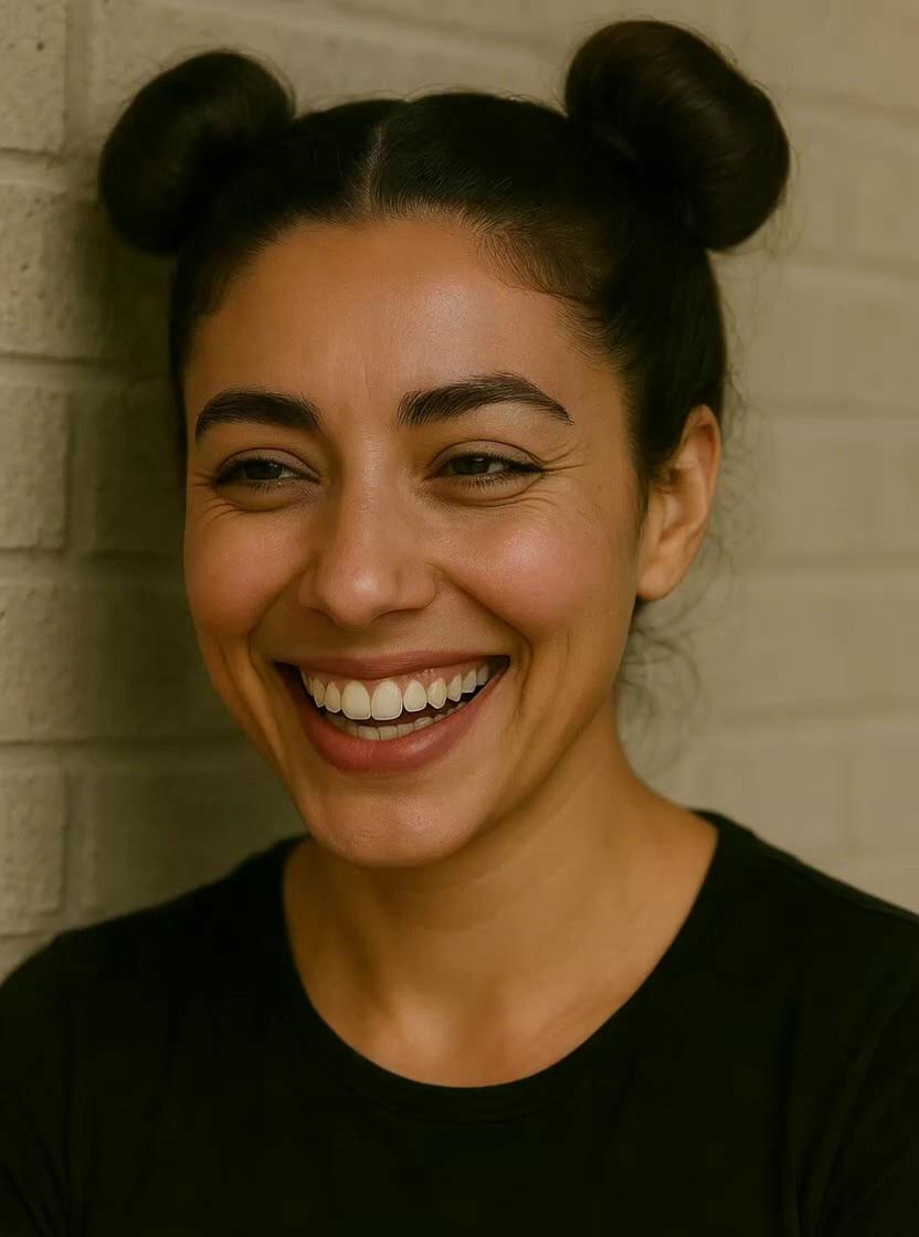 Prompt: A young woman laughing and saying hi to the camera 