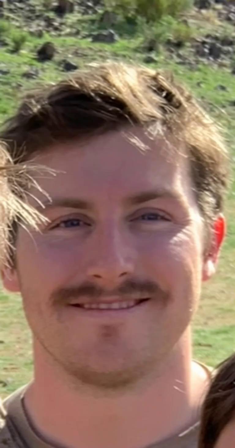 Prompt: I want the guy in this photo to be making a phone call and saying into the phone “Lily just do it! I’m scared to go on the RUT just lie and say you’re dilated please!”