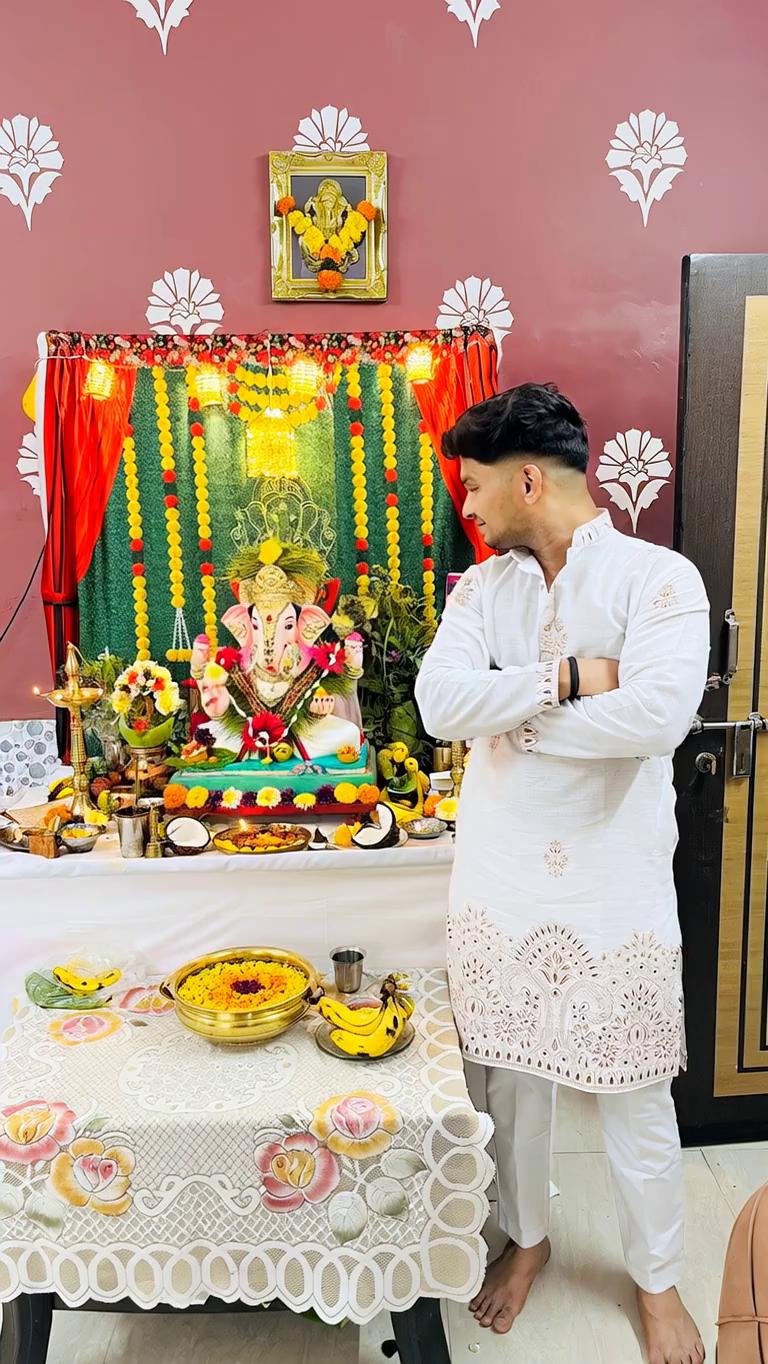 Prompt: Prompt - Make Lord Ganesha take a couple of steps forward, then stand up and hug the girl in front of him like a father lovingly hugging his daughter. The hug should be around her neck/shoulder area (not the face), and his trunk should also move naturally as if he is alive
