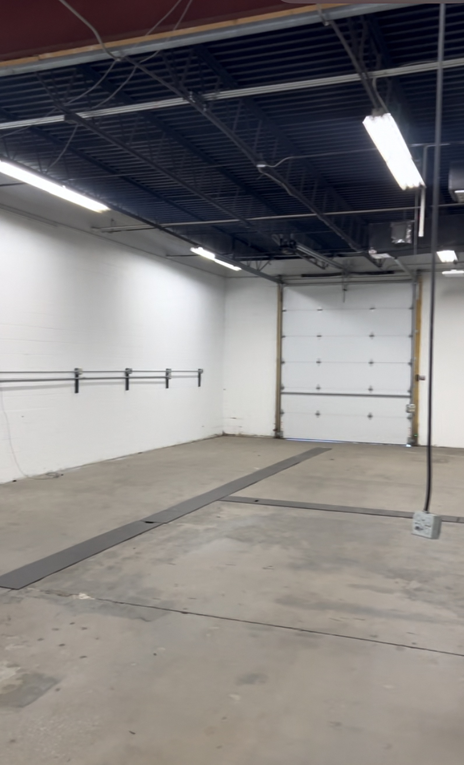 The Gloss Spot detail shop bay door at 606 N. Country Fair Dr, Champaign IL
