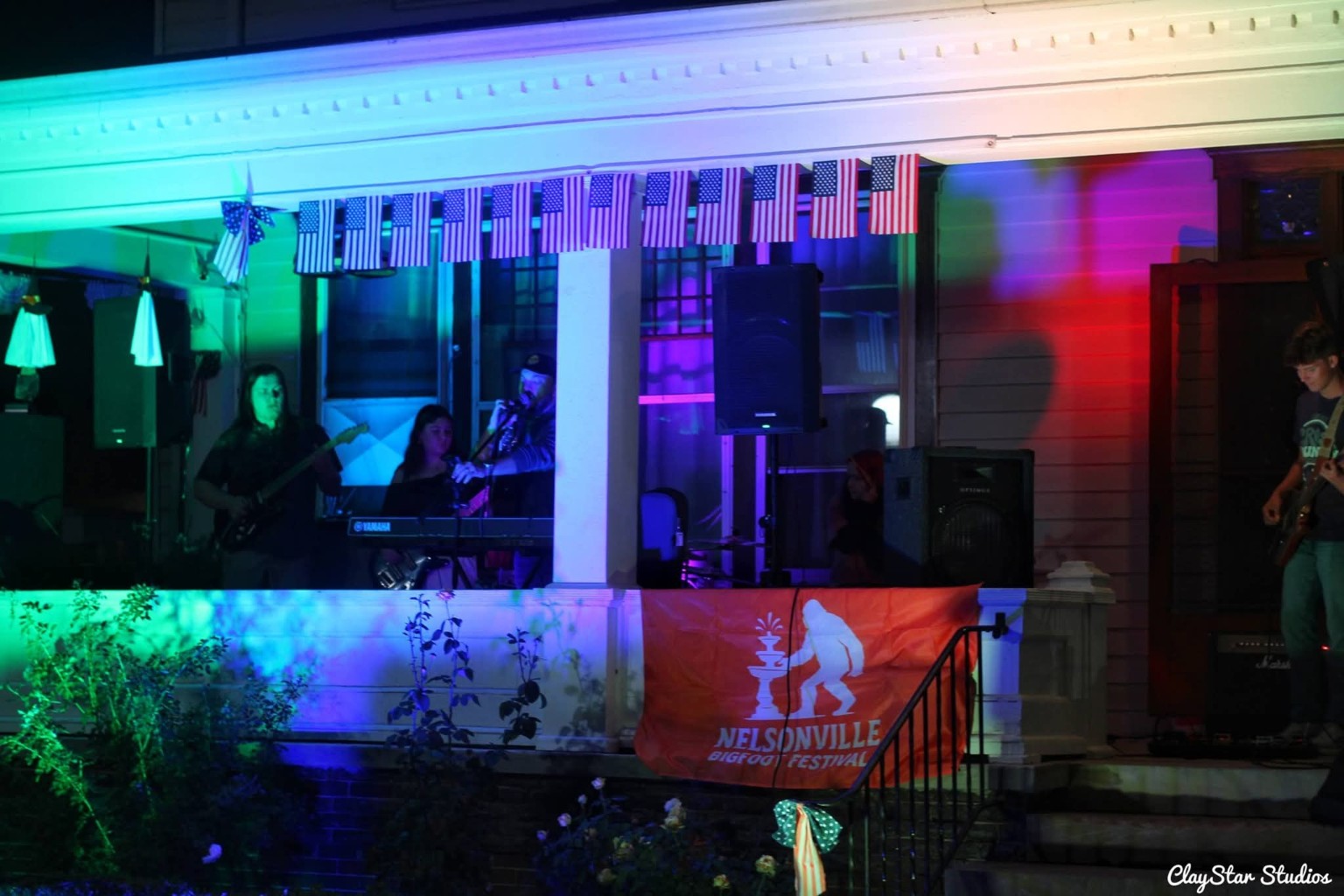 Live band performing under colored lights