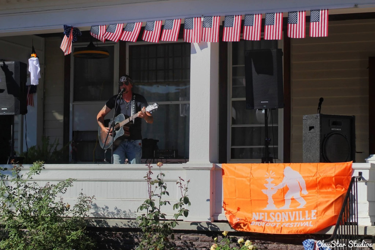 Daytime performer on the porch stage