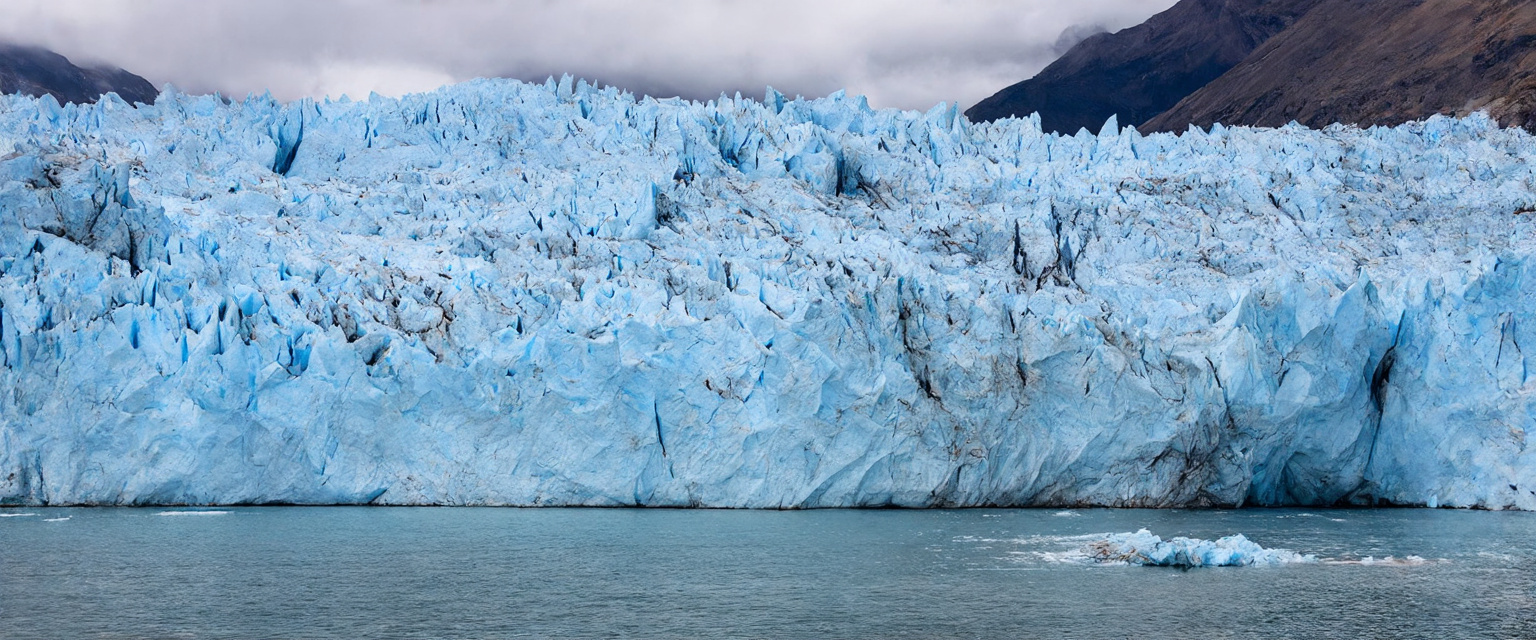 Prompt: The Perito Moreno Glacier is located in the Los Glaciares National Park in southwestern Argentina. It covers an area of 250 km², with a width of 5 km, an average height of 60 m above the water, an average depth of 170 m, and a maximum depth of 700 m.

The glacier moves at a rate of 2 meters per day, about 700 meters per year. However, as it is continuously melting, it has remained in the same place for the past 90 years.