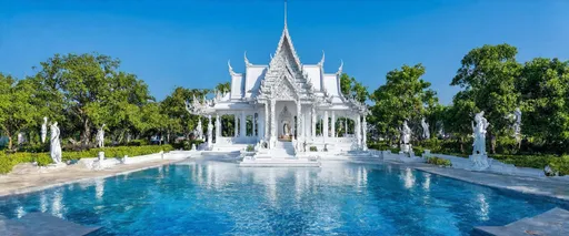 Prompt: Wat Rong Khun, Chiang Rai, Northern Thailand, Thailand

Wat Rong Khun, known as the White Temple, is located 13 km from the center of Chiang Rai. This modern Buddhist temple was designed and built by artist Chalemchai Kositpipat and opened to visitors in 1997. The temple impresses with its unique architecture, white color and many mirror elements symbolizing purity and spiritual enlightenment.

Inside the temple, you can see impressive paintings and sculptures that reflect Buddhist teachings and modern culture. The best time to visit is in the morning or evening, when the light highlights the beauty of the temple. You can get to Wat Rong Khun by taxi or bus from Chiang Rai.