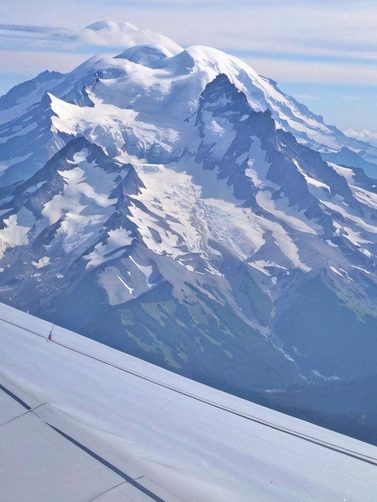 Prompt: a view of a High Above Mt. Rainier  regionalism, mountains, a photo