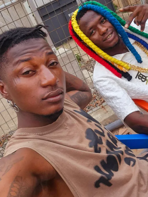 Prompt: ALi Boubacar best friend B B tattoo Wizard  Accra Ghana 