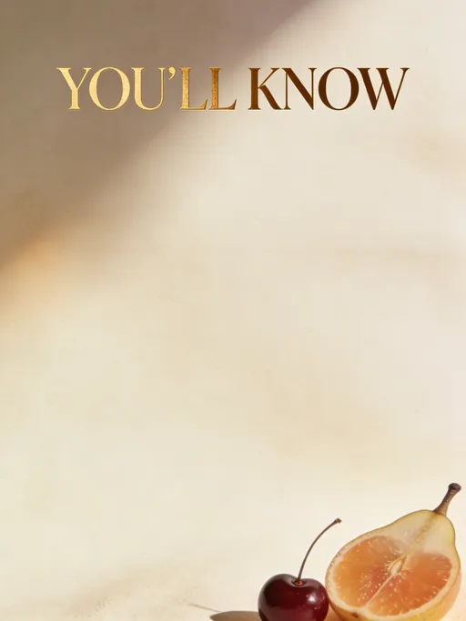 Prompt: Create a flat layout  Background: Soft warm ivory or sand tone with subtle refined paper texture. Full frame of the design, not an actual looking page in a book. This is an addition to the book I'm making.

At the top center, elegant serif title text reads “YOU’LL KNOW” in a  warm golden tone. 

Below the title is empty space for text (no visible body text, blank area intentionally left clean).

Soft, diffused natural lighting across the page with a subtle warm gradient, no harsh shadows. Include a very minimal fruit detail (such as a pear, cherry, or citrus slice) placed delicately in the bottom corner.

The design should feel calm, grounded, feminine, and premium with lots of negative space. Inspired by high-end cookbooks and editorial wellness guides.

Style: dark luxury culinary wellness, minimalist editorial
Color palette: cream, warm beige, taupe, charcoal text
Composition: centered title, blank lower page, small corner detail


