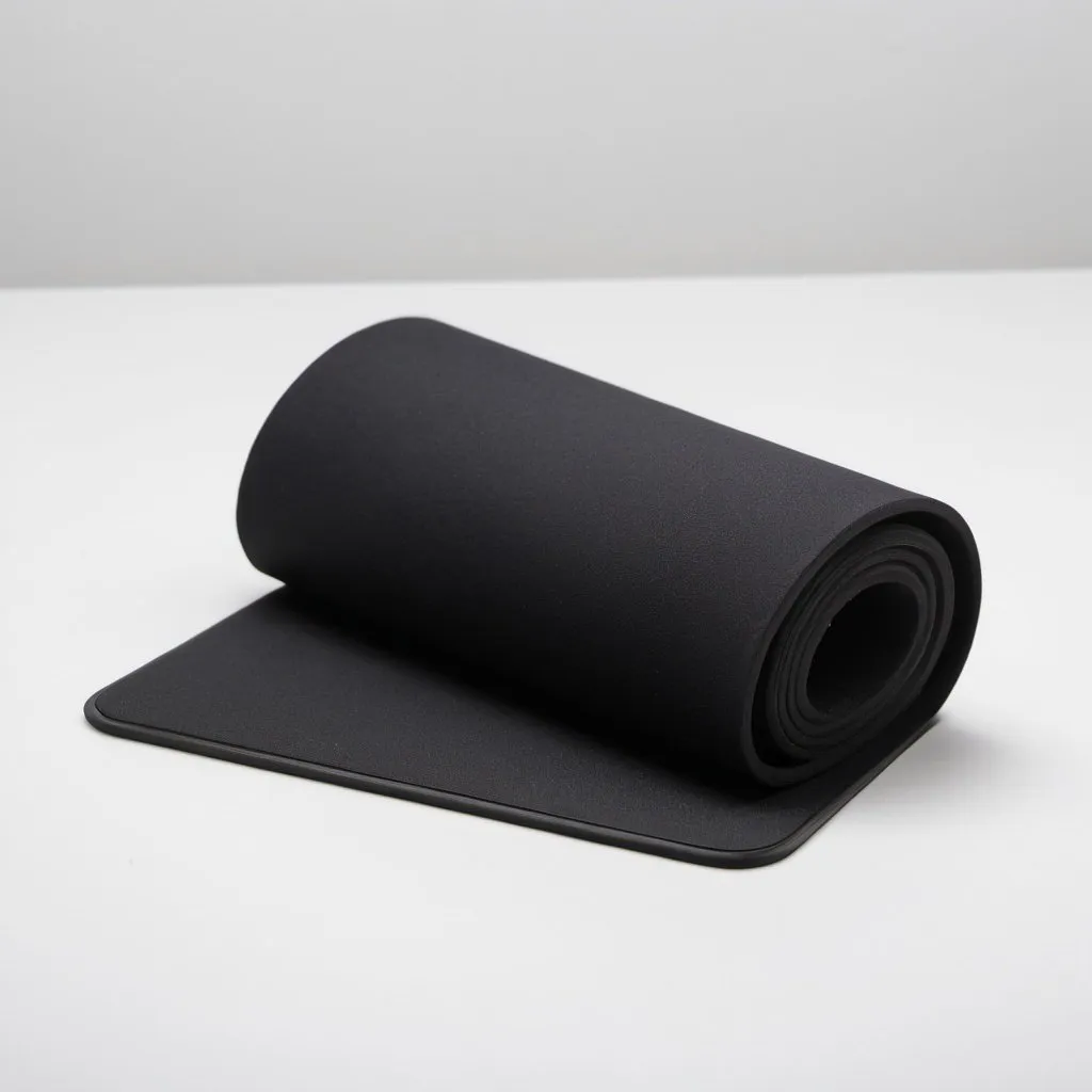 Prompt: a black mouse pad tightly rolled up with white background. The mouse pad has a rubber back and fabric top.  There is nothing else in the image.
