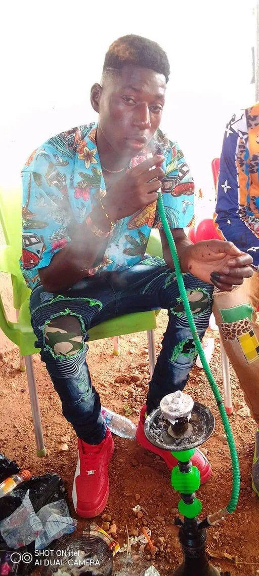 Prompt: ALi Boubacar's his smoke the hookahs 