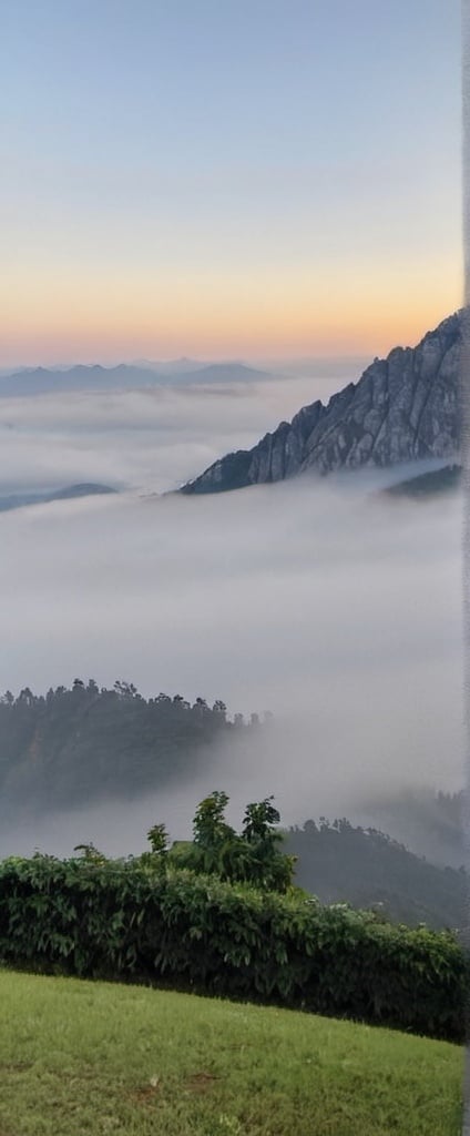 Prompt: Mountains in the early morning. It's foggy