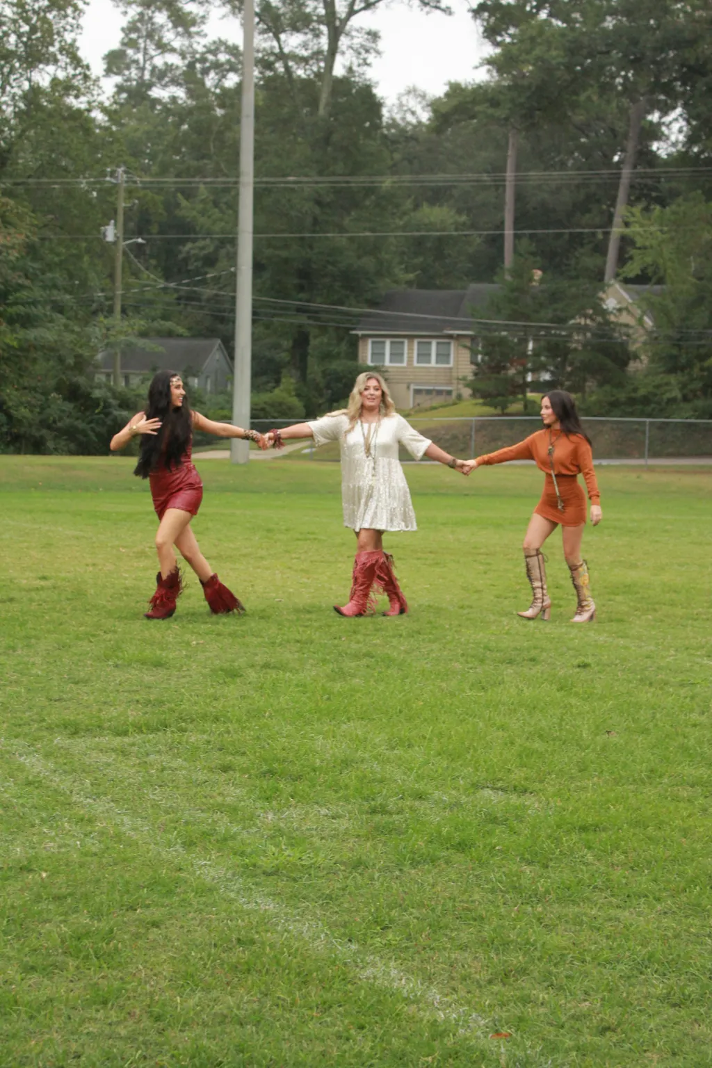 Prompt: Make the three girls blurry as if they are running