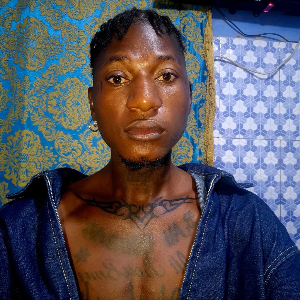 Prompt: ALi Boubacar Chest Tribal Tattoo images