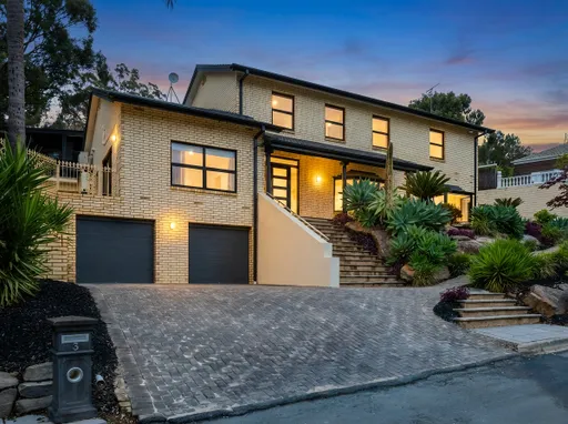 Prompt: Convert this real estate photograph from daytime to twilight.
Keep the house, architecture, driveway, garden, shadows, landscaping, and framing exactly the same as the reference image.
Do not add, alter, remove, or reposition anything.
Change the lighting to twilight/dusk.
Turn on all exterior lights with a soft, natural glow.
Make the internal windows glow warmly, but not overly yellow — neutral warm light that feels realistic and inviting.
Add gentle ambient blue twilight tones to exterior surfaces.
Replace the sky with a natural twilight/dusk sky — subtle blues and sunset tones, no stars, no clouds added unless naturally consistent with the scene.
Ensure shadows and colour reflections match the new time of day.
Ultra realistic, photo-accurate, no new objects, no stylistic filters, exact same composition, hyper-clean edges, natural exposure and contrast.