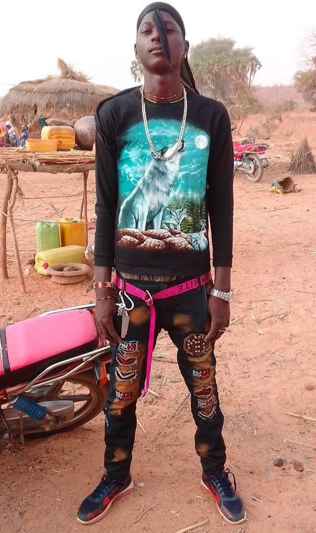 Prompt: Seeking images of Ali Boubacar in a traditional African village setting."